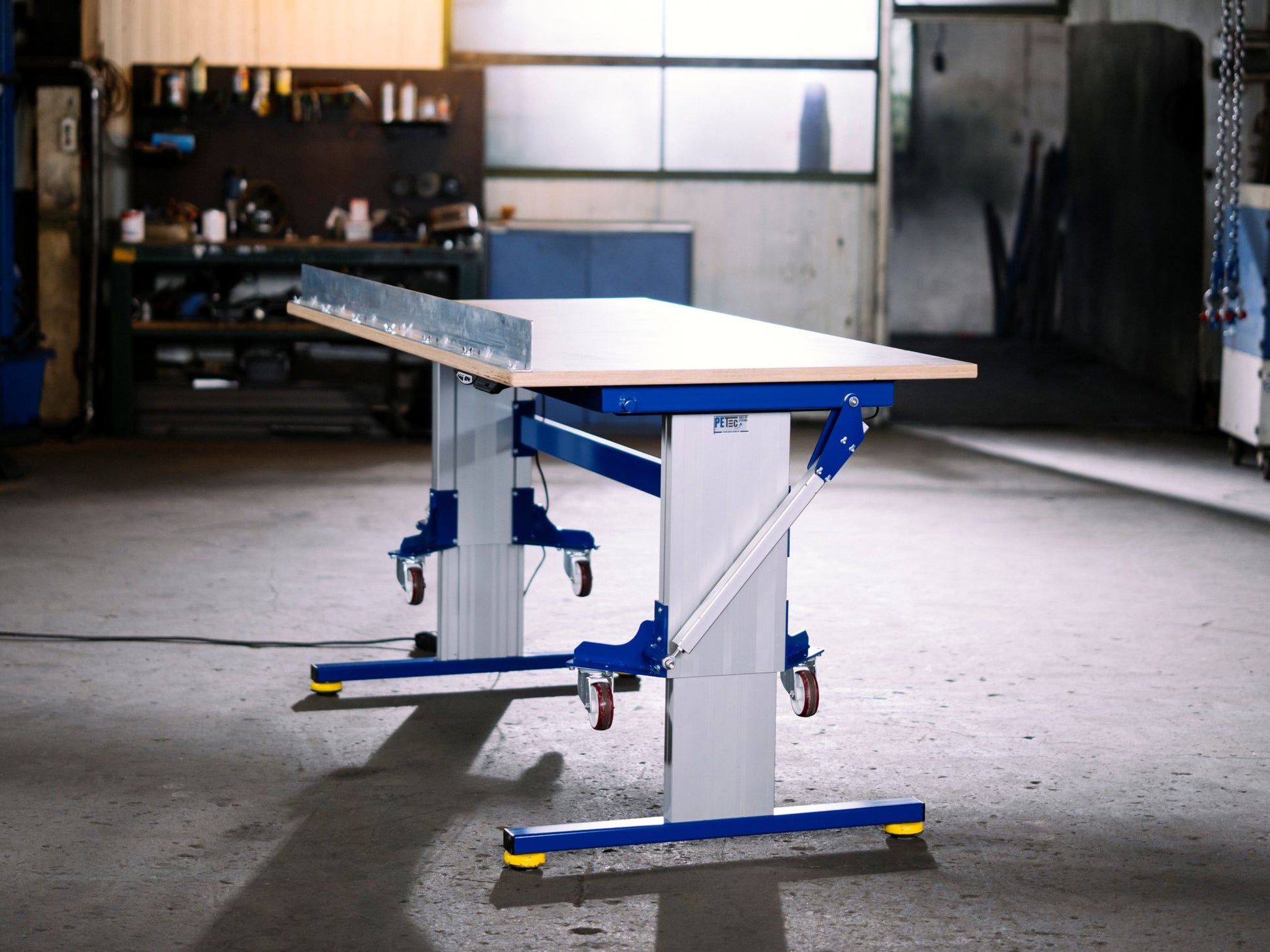 height adjustable working table, flexible on casters, and tilting 